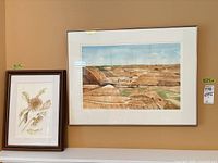 Both framed watercolors side by side
