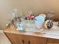 All vases arranged on cabinet