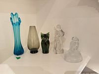 Group view of five glass and crystal items
