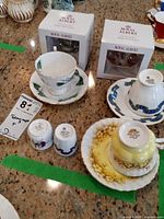All three teacup & saucer sets, two thimbles, two boxed ornaments overview