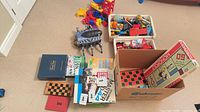 Overview of all items including board games, blocks, baskets and R/C bug toy