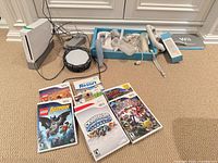 Overall lot showing console, accessories, six games
