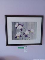 Framed watercolor painting on wall showing full view