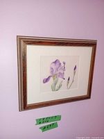 Framed watercolor iris painting on wall showing full frame