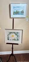 Overall view showing both framed watercolors and wooden easel