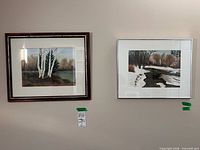 Both framed watercolors on wall
