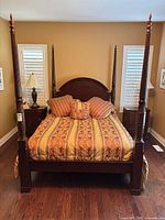 Full view of assembled queen four-poster bed with bedding