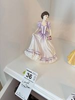 Front view of Royal Doulton Suzanne figurine showing full gown and bouquet