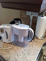 Salton kettle, Brita pitcher on countertop