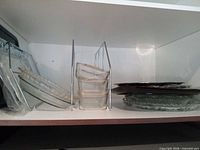 overview of all glass dishes and metal rack on shelf