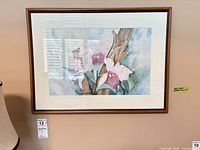 Front view of orchid watercolor painting in wood frame with mat and glass