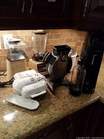 Group view of all five appliances on countertop