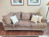 Front view of fabric sofa with throw pillows