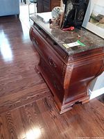 Front and top view showing marble surface, drawer fronts, hardware