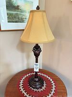 Table lamp full view showing shade, body and finial