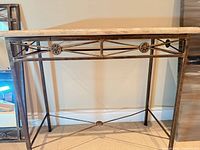 Full view of console table showing marble top and metal frame