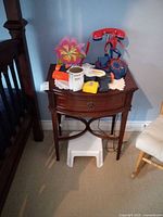 Full view of side table with items on top (not included)