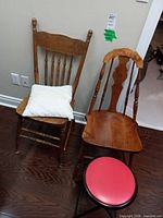 Two wooden chairs and folding stool overview