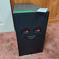 Full rear view of subwoofer showing terminals and label