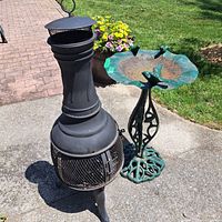 Birdbath and chiminea full view