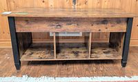 Front view showing tabletop, legs, three cubbies