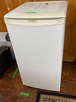 Front view of Danby compact refrigerator showing white finish and curved top door