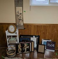 Lot overview with scroll, shelf, clock, frames, baskets