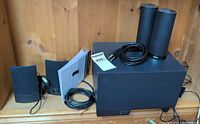 Complete lot: subwoofer, both speaker pairs, cables, instruction sheet