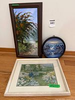 Group shot of three framed artworks showing sizes and frames