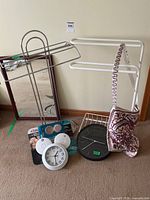 Group shot showing all items: mirror, racks, clocks, smoke alarms, bag