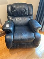 Front view of dark blue leather recliner chair