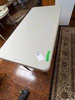 Top view of Lifetime folding table showing full 24x48 in surface and metal legs