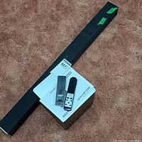 Sound bar, remote, and Quick Start Guide on carpet