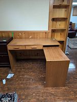 Front view of wooden desk showing two drawers and extension retracted