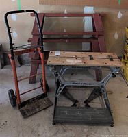Overall view of hand truck, Workmate bench, and sawhorses