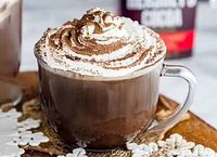 Cup of hot chocolate with whipped cream, illustrative restaurant offering