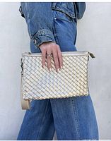Metallic woven faux-leather bag shown worn crossbody