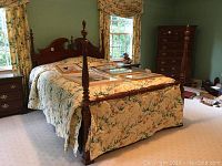 Full view of four-poster bed frame with headboard, footboard and posts.