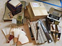 Full assortment of canvas panels, fans, brushes, ink sticks, ink stone, carving tools and incense coils