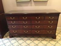 Front view of dresser showing three rows of drawers