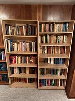 Front view of both tall wood bookcases
