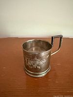 Side view showing floral engraving and 800 hallmark