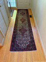 Full overhead view of Persian wool runner in hallway