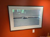 Full view of framed print on wall