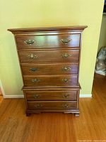 Front view of six-drawer chest showing full height and hardware