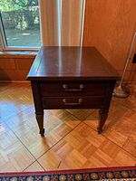 Front view showing full table, drawers, legs, finish