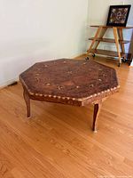 full view of octagonal coffee table top and legs