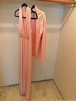 Evening gown and jacket on hanger showing full set