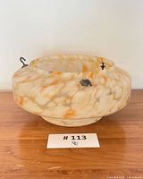 Overall view of marbled glass plafonnier shade showing color and attached hooks