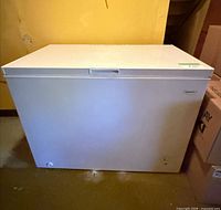 Front view of Brada chest freezer showing white exterior and lid